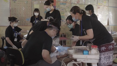 The CSMU Cambodia Dental Outreach Team provides oral examinations and dental treatment for local residents and schoolchildren, delivering professional dental care to underserved communities.