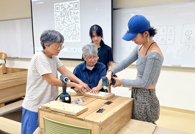 Students building compost bins during the Zero Food Waste workshop.